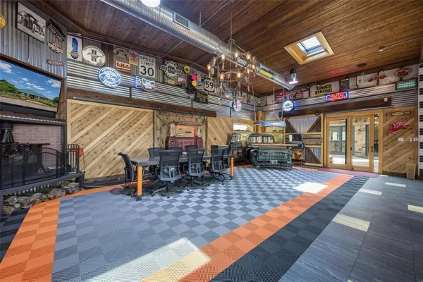 a view of lobby with a hallway and wooden floor