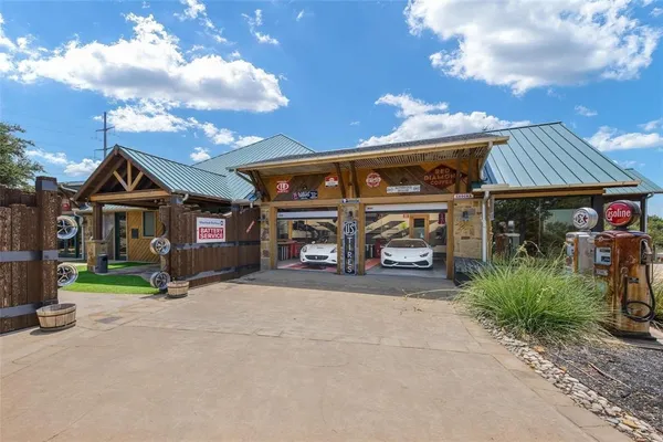 a view of a car park in front of house