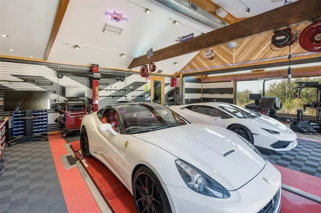an aerial view of a house with a lake view