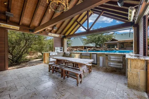 a view of a backyard with wooden fence