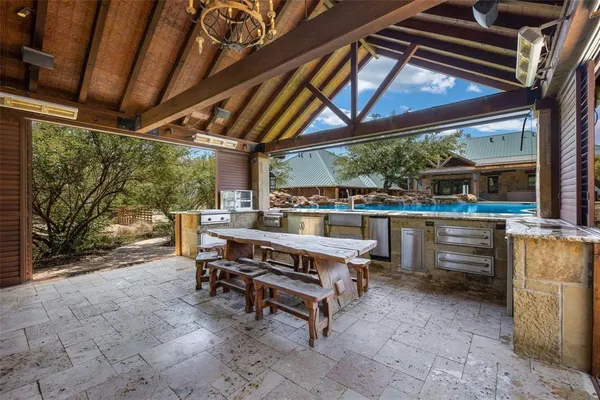 a view of a backyard with wooden fence