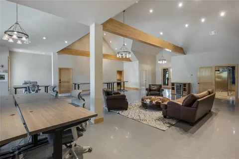 a kitchen with stainless steel appliances granite countertop a sink and a refrigerator