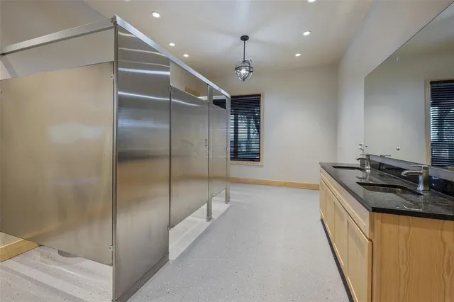 a view of a brick building with a large tree