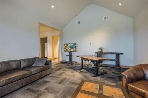 a kitchen with stainless steel appliances granite countertop a stove and a refrigerator