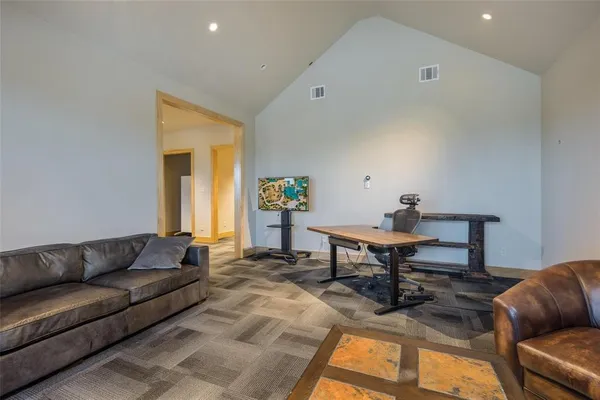 a kitchen with stainless steel appliances granite countertop a stove and a refrigerator