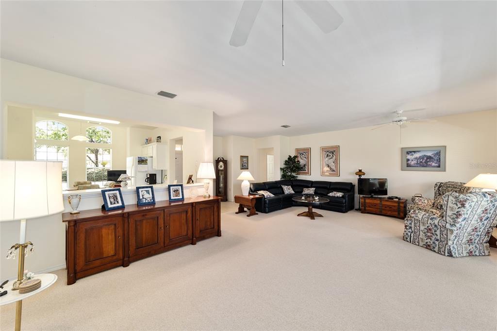 12896 Southeast 91st Terrace Road Summerfield, FL 34491 - Photo 16 of 77 a living room with furniture and kitchen area