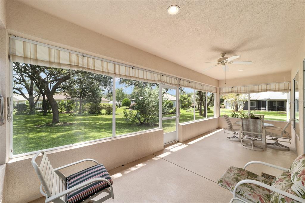 12896 Southeast 91st Terrace Road Summerfield, FL 34491 - Photo 39 of 77 a living room with hardwood floor and a large window