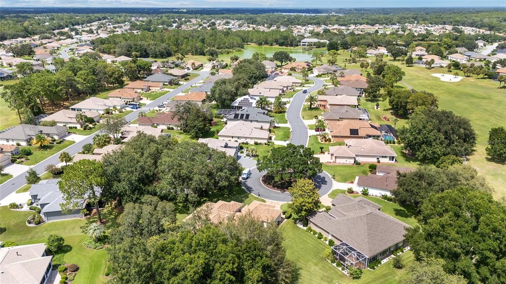 12896 Southeast 91st Terrace Road Summerfield, FL 34491 - Photo 53 of 77 an aerial view of residential houses with outdoor space
