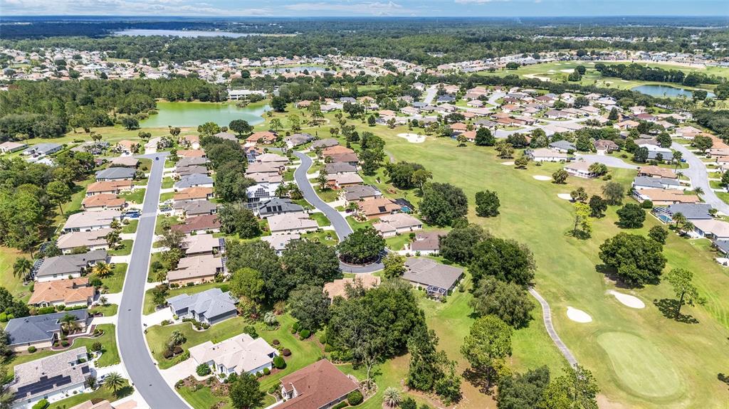 12896 Southeast 91st Terrace Road Summerfield, FL 34491 - Photo 56 of 77 an aerial view of residential houses with outdoor space and trees