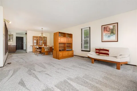 a view of a bedroom with furniture window and a bathroom