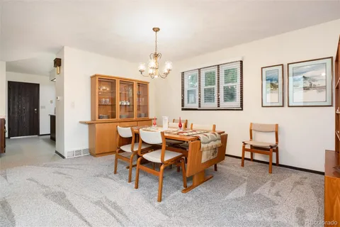 a living room with furniture and windows