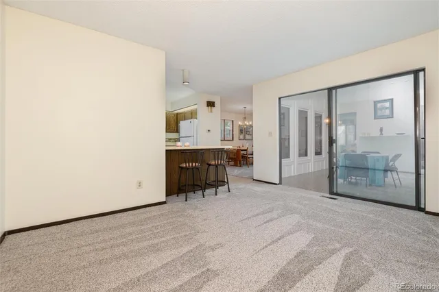 a spacious bedroom with a bed and a window