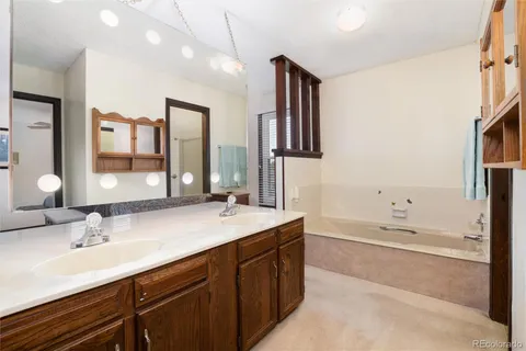 a bathroom with bathtub and shower