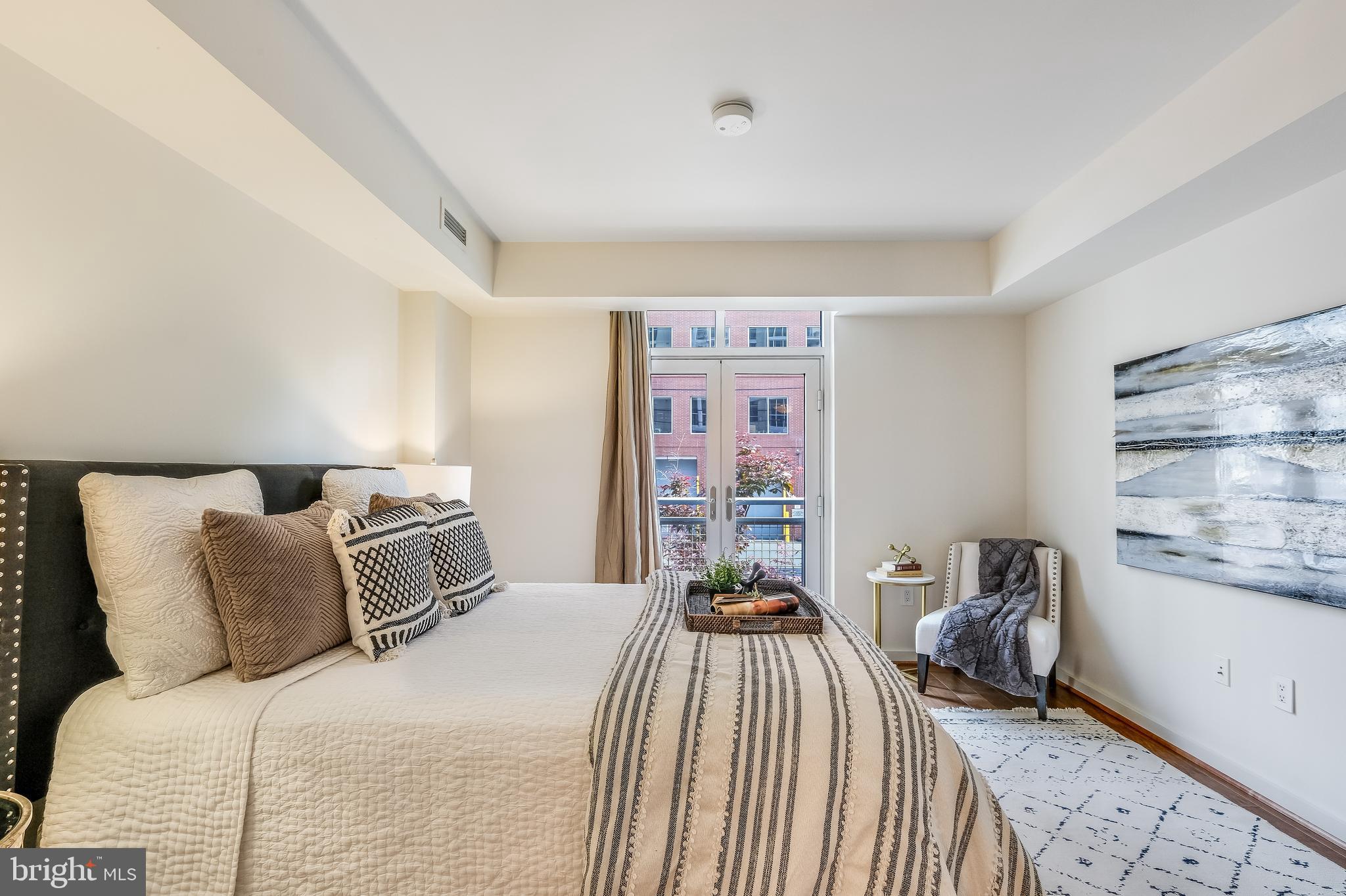 1025 First Street Southeast, Unit 201 Washington, DC 20003 - Photo 15 of 31 a bedroom with a bed and a window