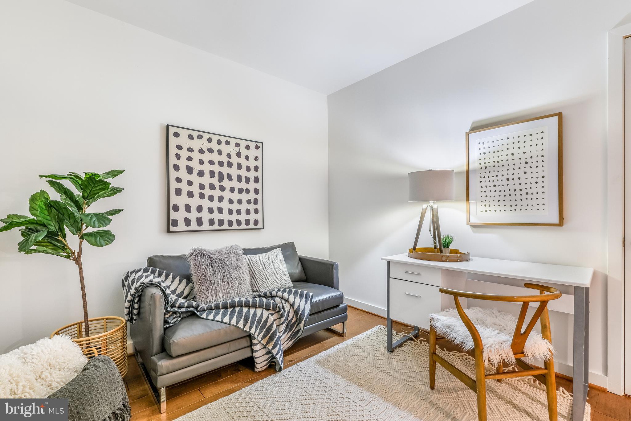 1025 First Street Southeast, Unit 201 Washington, DC 20003 - Photo 20 of 31 a living room with furniture