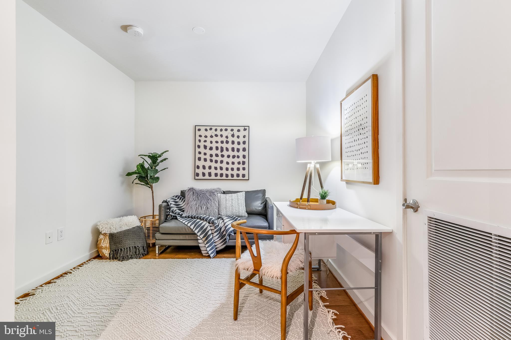 1025 First Street Southeast, Unit 201 Washington, DC 20003 - Photo 21 of 31 a living room with furniture and a window