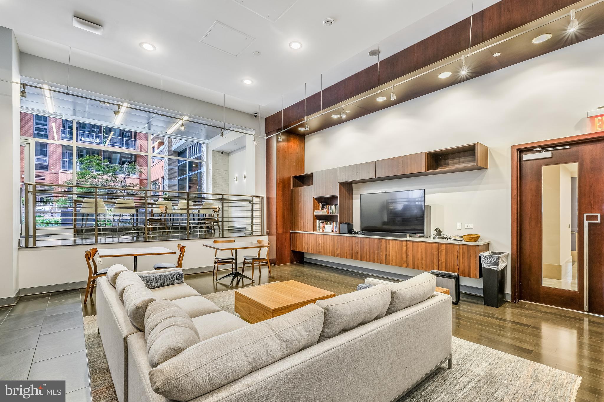 1025 First Street Southeast, Unit 201 Washington, DC 20003 - Photo 23 of 31 a living room with furniture and a flat screen tv