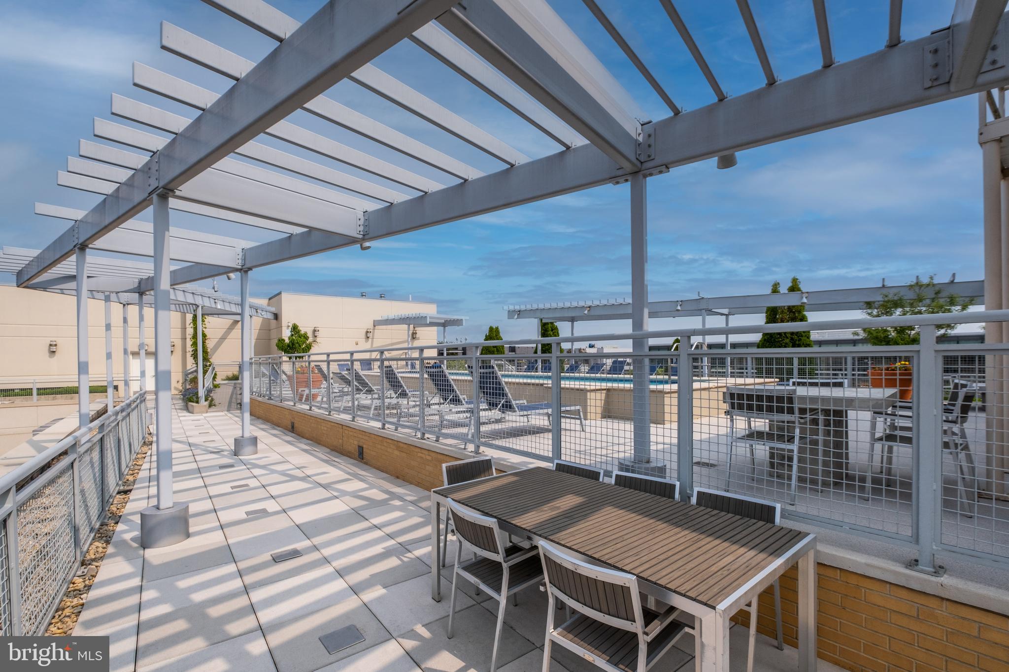 1025 First Street Southeast, Unit 201 Washington, DC 20003 - Photo 27 of 31 a dining room with furniture and a floor to ceiling window