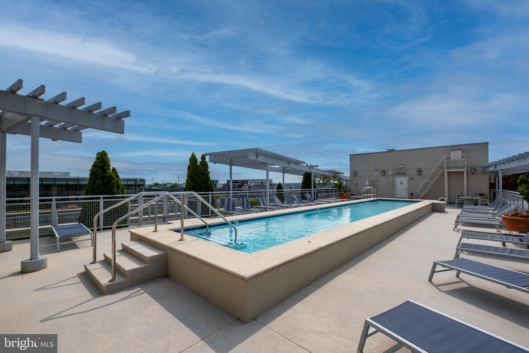 1025 First Street Southeast, Unit 201 Washington, DC 20003 - Photo 29 of 31 a view of a swimming pool with seating space