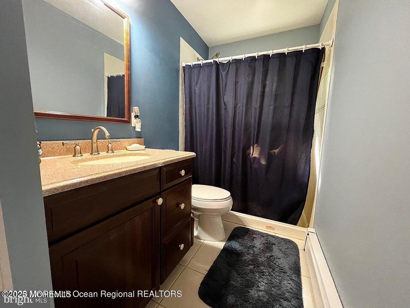 791 Harmony Road Jackson, NJ 08527 - Photo 13 of 16 a bathroom with a sink a toilet and mirror