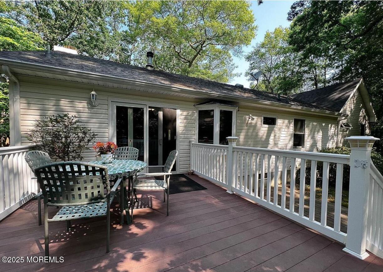 791 Harmony Road Jackson, NJ 08527 - Photo 14 of 16 a view of a chair and table in the balcony