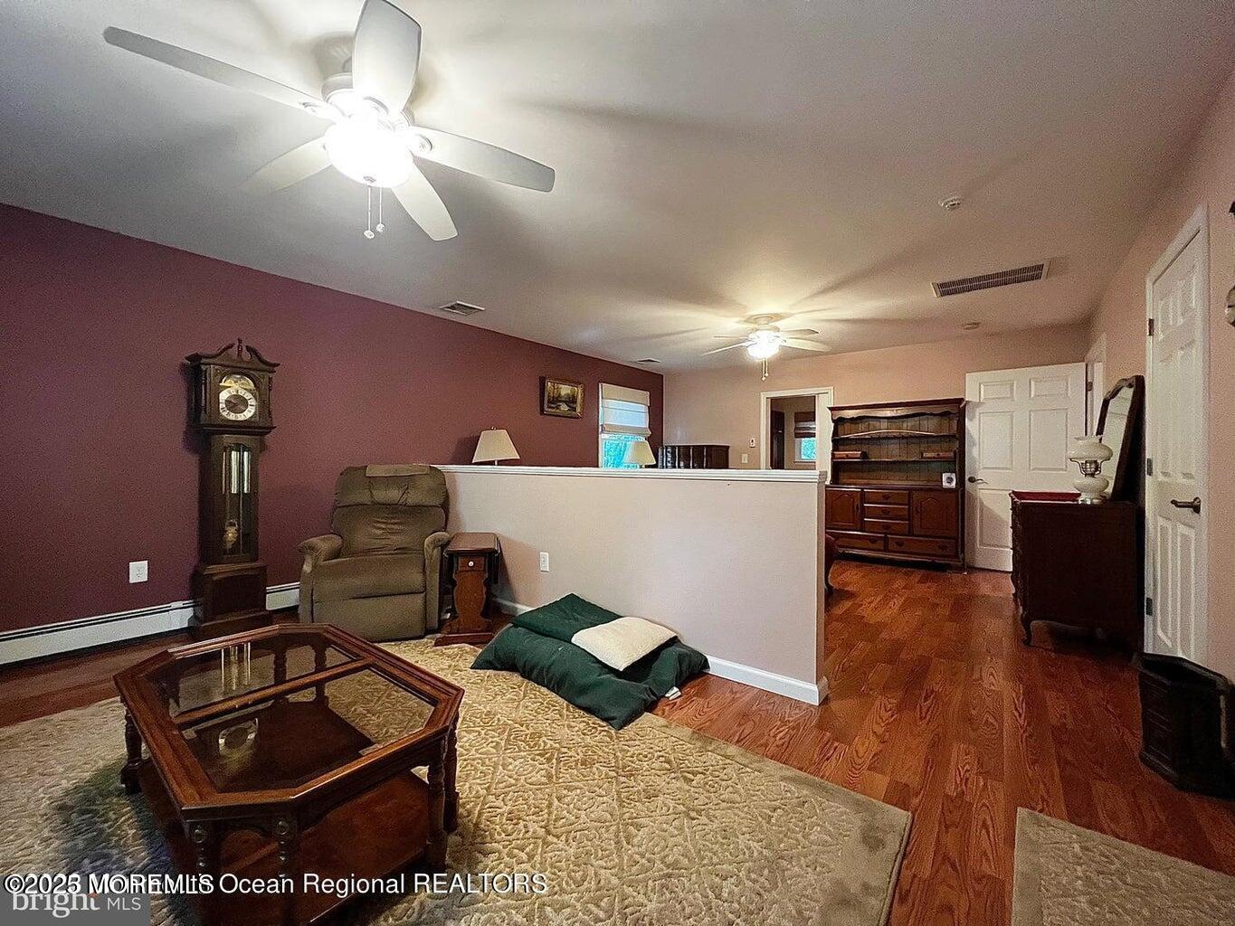 791 Harmony Road Jackson, NJ 08527 - Photo 4 of 16 a living room with furniture and a wooden floor