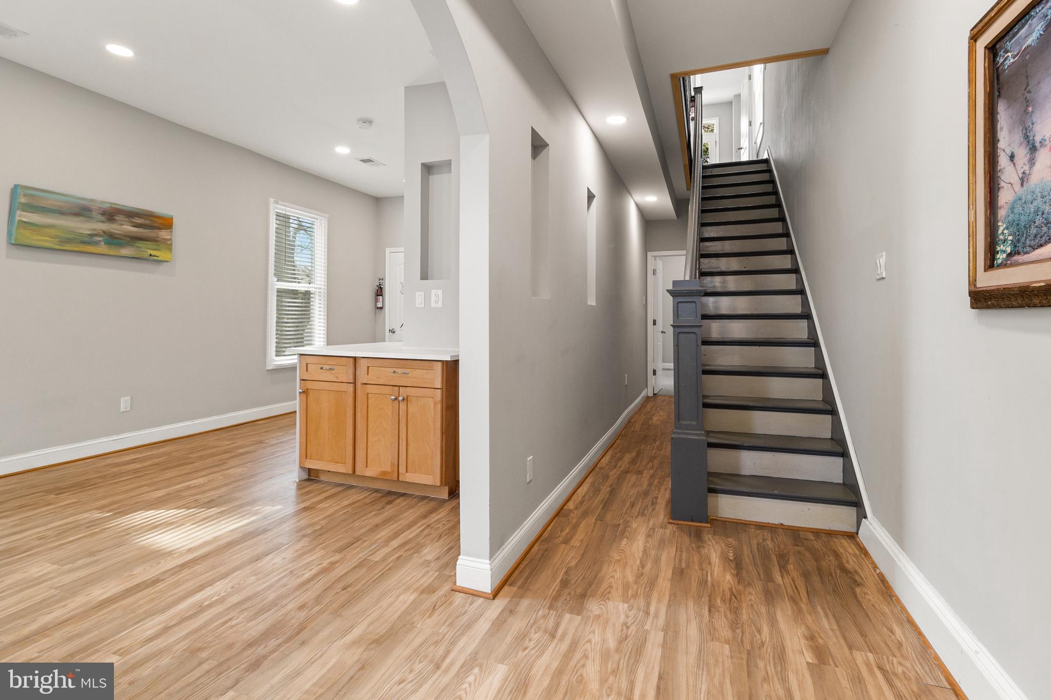 910 Savannah Street Southeast Washington, DC 20032 - Photo 2 of 26 a view of a hallway with wooden floor and stairs