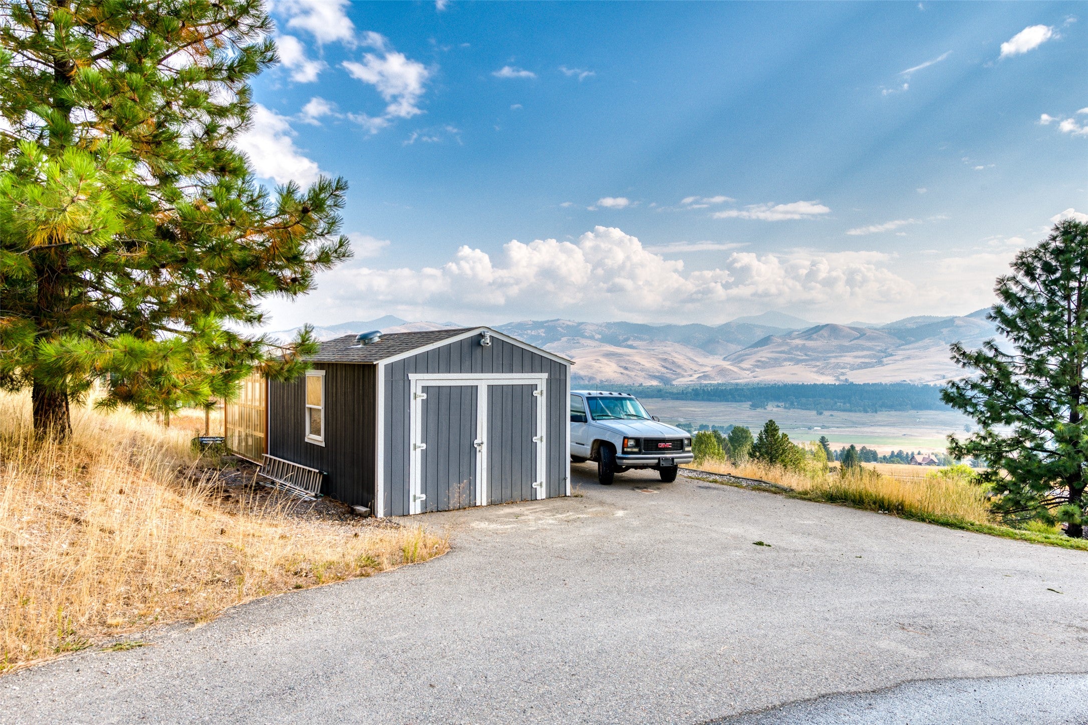 16374 Folsom Road Florence, MT 59833 - Photo 19 of 98 View of shed featuring a mountain view