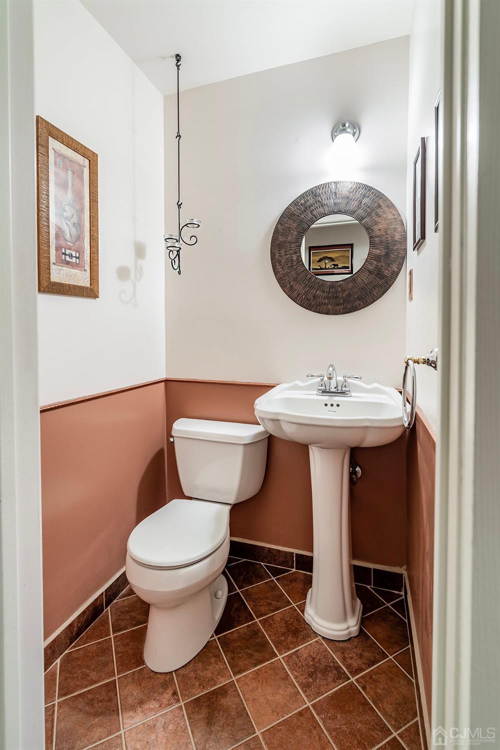 606 Robin Road Hillsborough, NJ 08844 - Photo 11 of 20 a bathroom with a sink toilet and a mirror