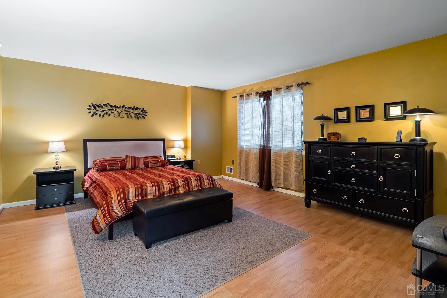 606 Robin Road Hillsborough, NJ 08844 - Photo 12 of 20 a spacious bedroom with a bed and a dresser