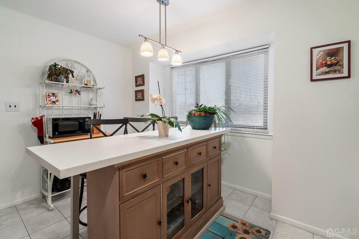 606 Robin Road Hillsborough, NJ 08844 - Photo 2 of 20 a kitchen with a sink a stove and cabinets