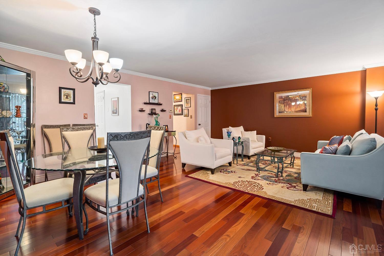 606 Robin Road Hillsborough, NJ 08844 - Photo 9 of 20 a living room with furniture dining table and a chandelier
