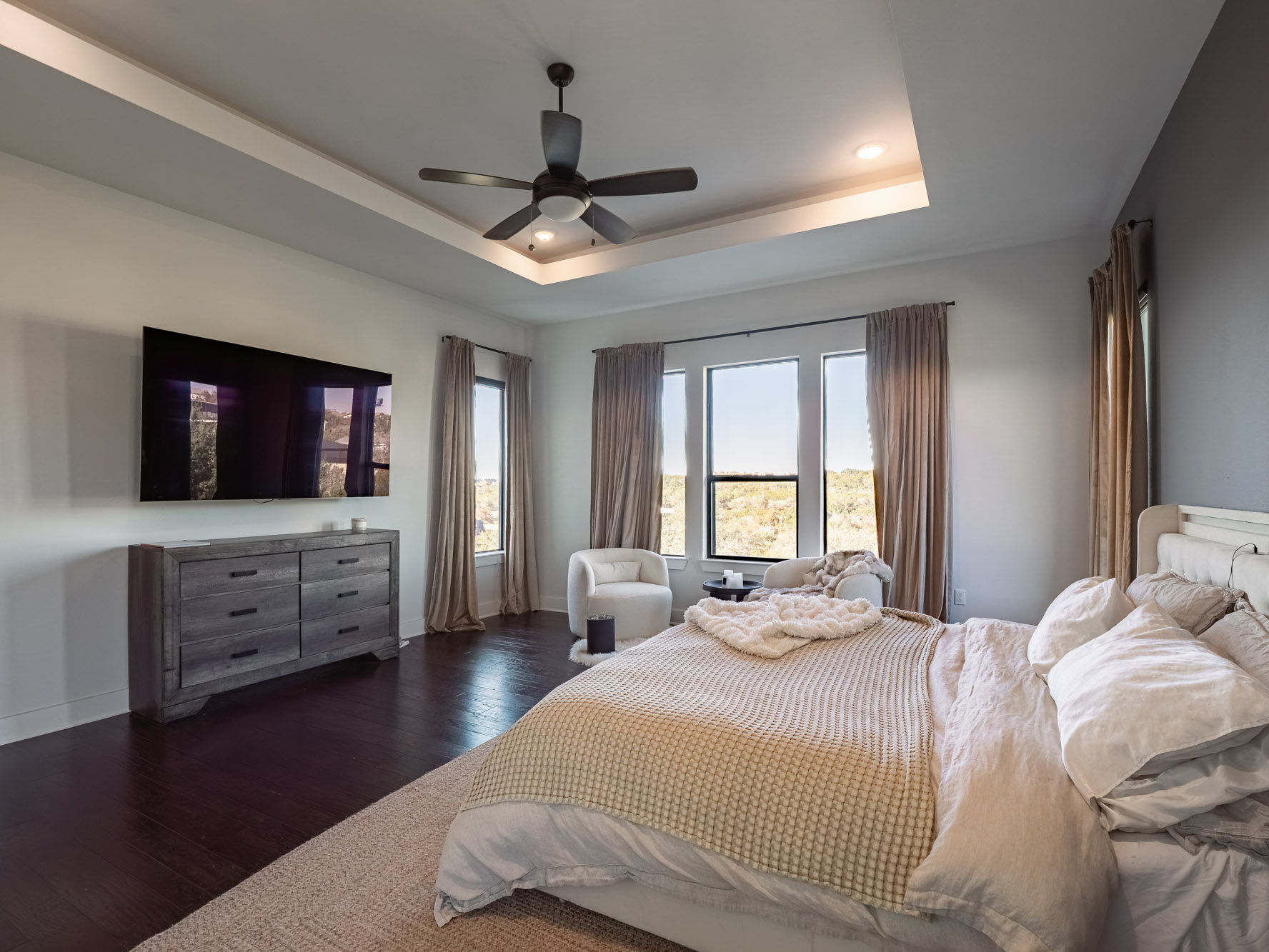 14900 Copper Ridge Lane Austin, TX 78734 - Photo 19 of 39 Bedroom with hardwood / wood-style floors, a raised ceiling, and ceiling fan
