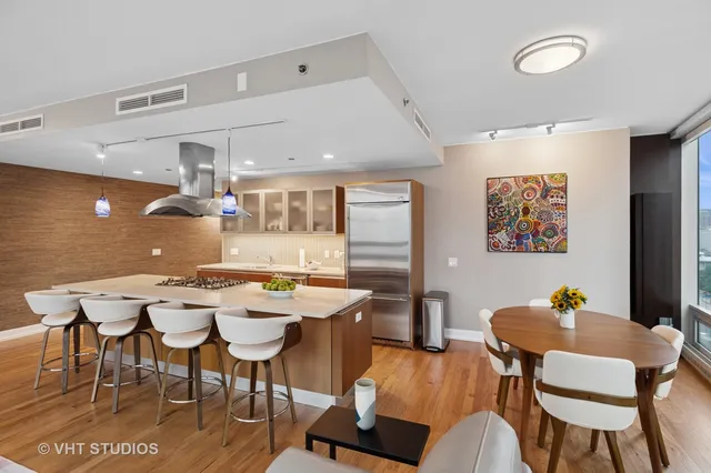 a kitchen with a table and chairs in it