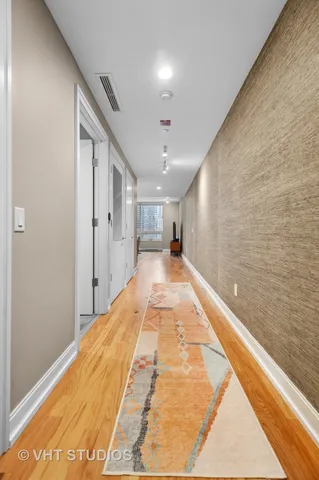a view of hallway with a large window