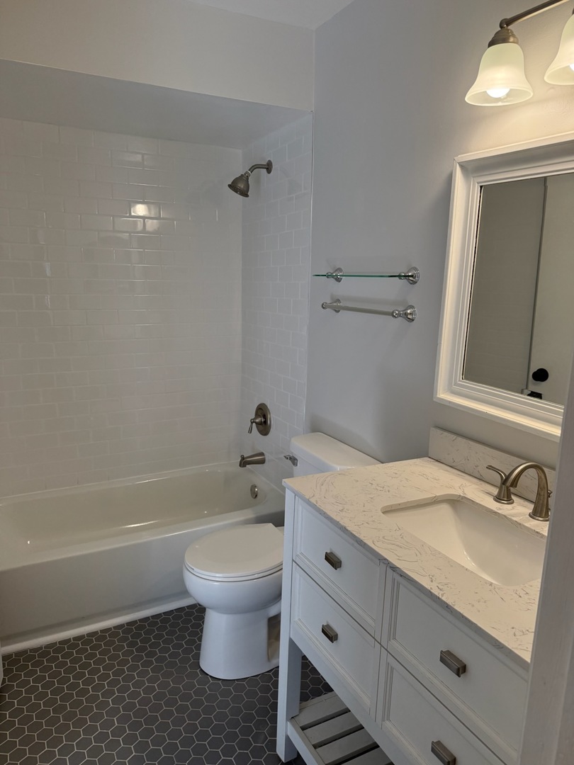 5513 Barclay Court Clarendon Hills, IL 60514 - Photo 13 of 20 a bathroom with a sink toilet and shower