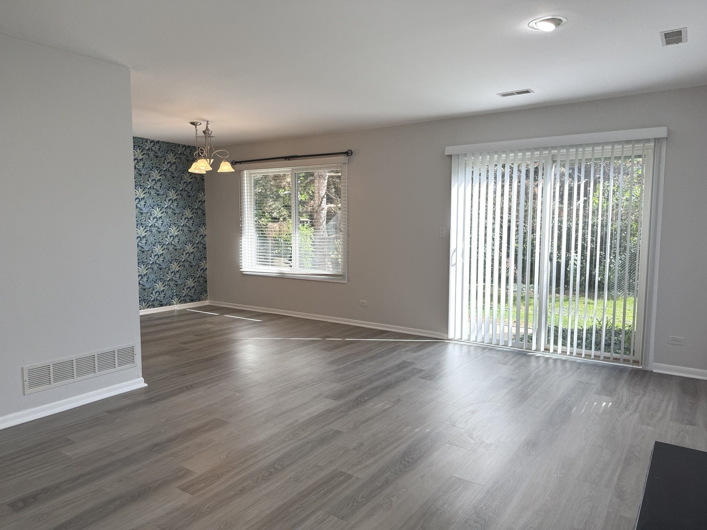 5513 Barclay Court Clarendon Hills, IL 60514 - Photo 8 of 20 an empty room with wooden floor and windows