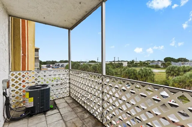 a view of balcony with furniture