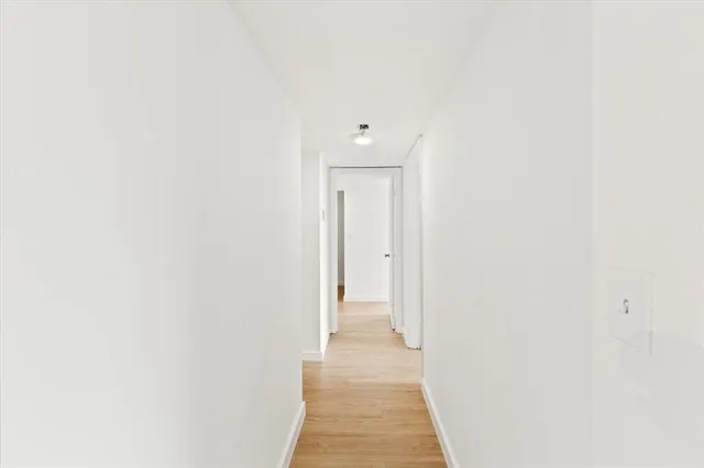 a view of a hallway with closet