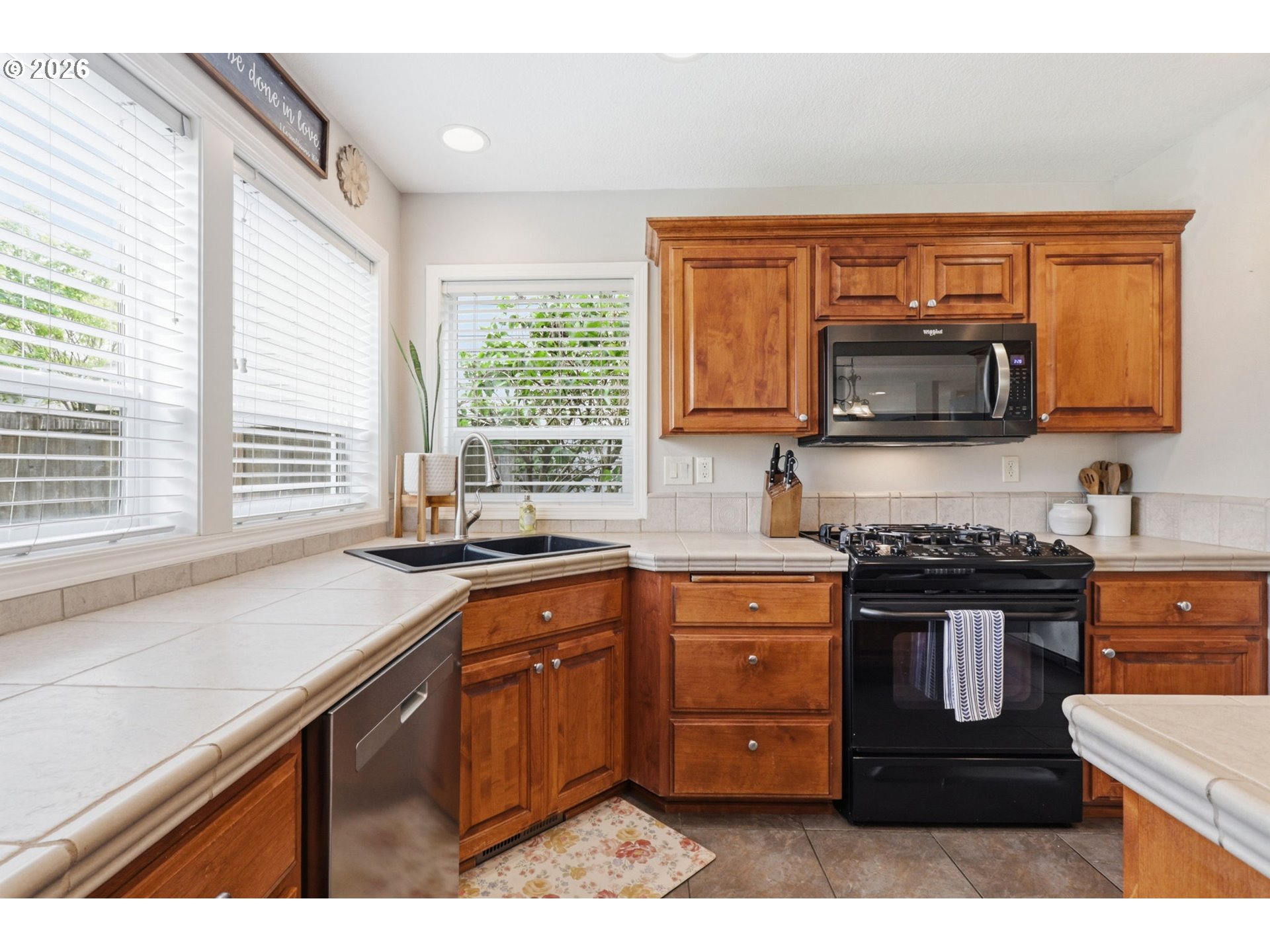 3306 Solstice Lane Newberg, OR 97132 - Photo 11 of 47 a kitchen with stainless steel appliances granite countertop a stove a sink and a microwave
