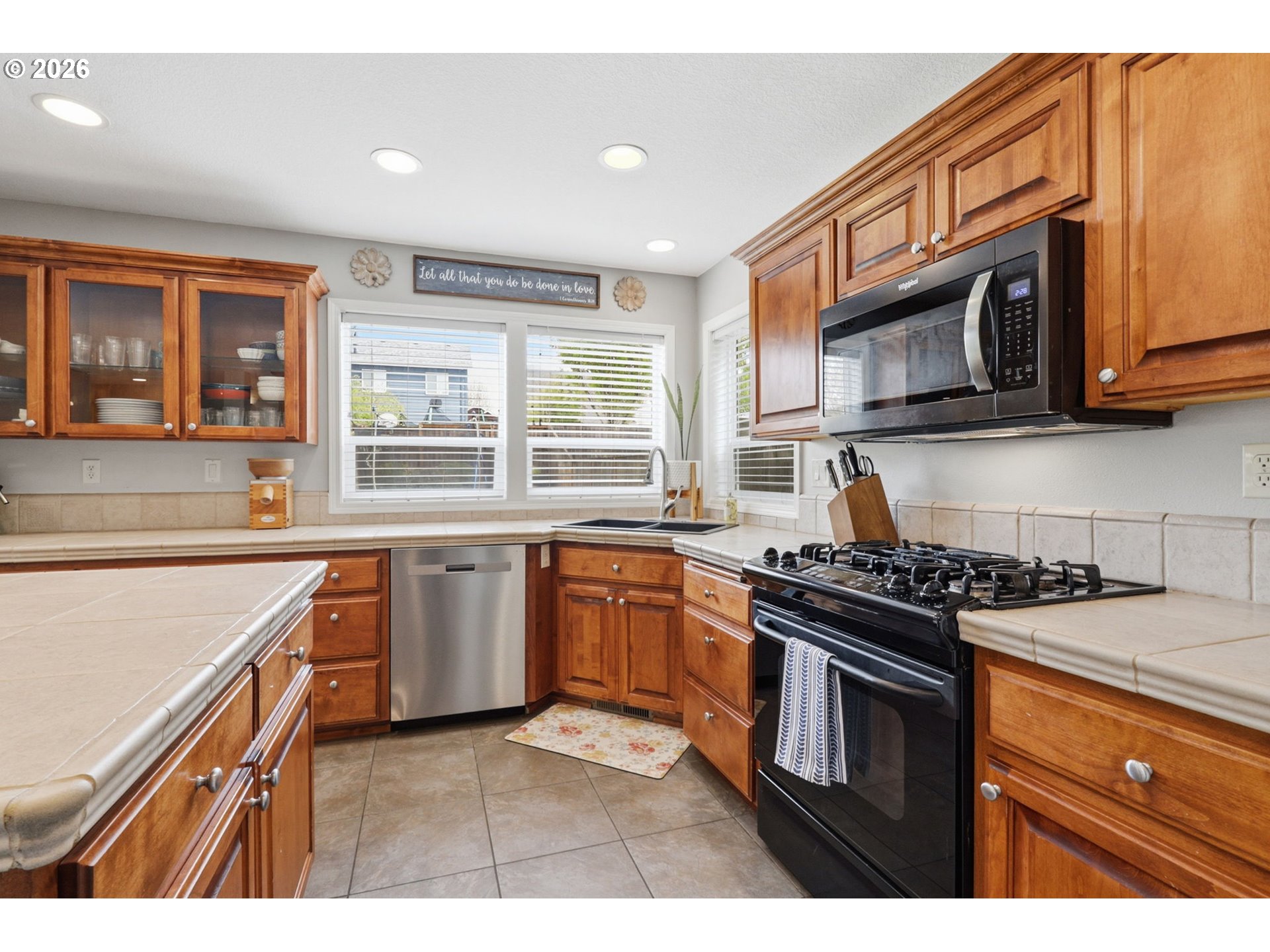 3306 Solstice Lane Newberg, OR 97132 - Photo 12 of 47 a kitchen with stainless steel appliances granite countertop a stove sink and microwave