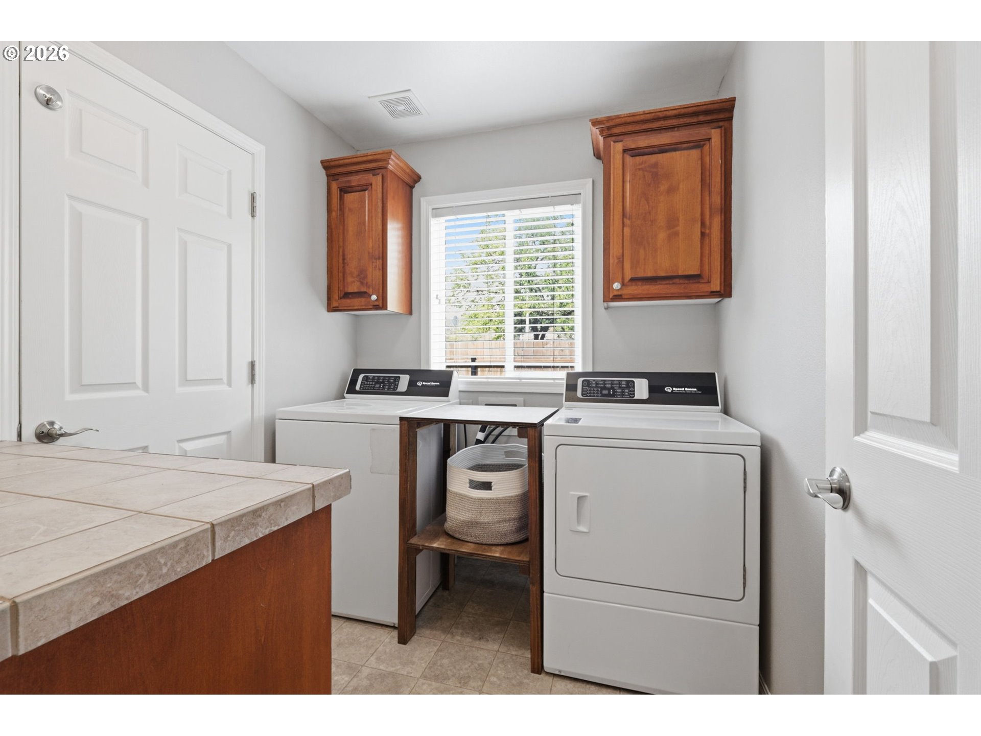 3306 Solstice Lane Newberg, OR 97132 - Photo 19 of 47 a kitchen with a stove cabinets and a window