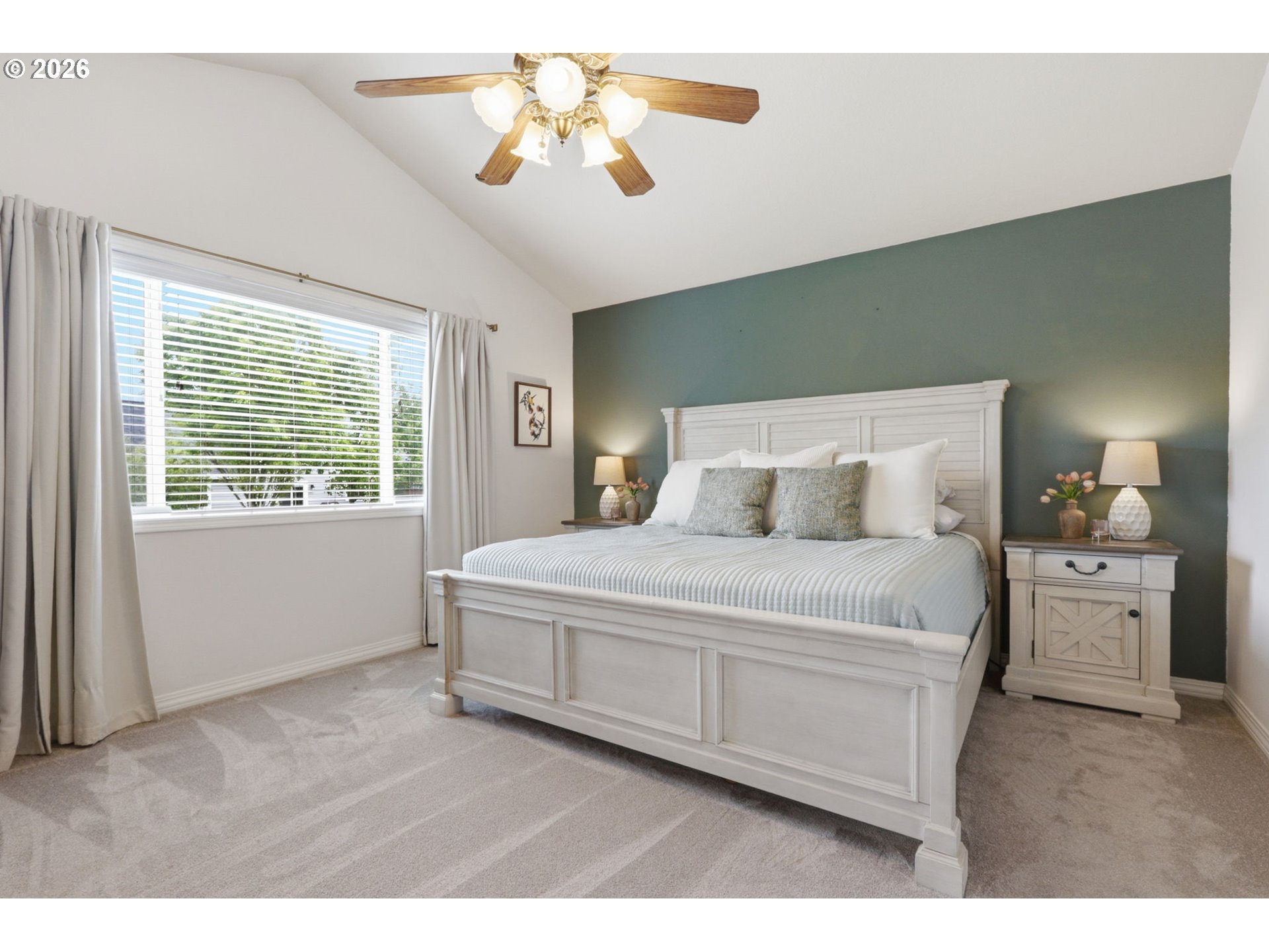 3306 Solstice Lane Newberg, OR 97132 - Photo 32 of 47 a bedroom with a large bed and a chandelier