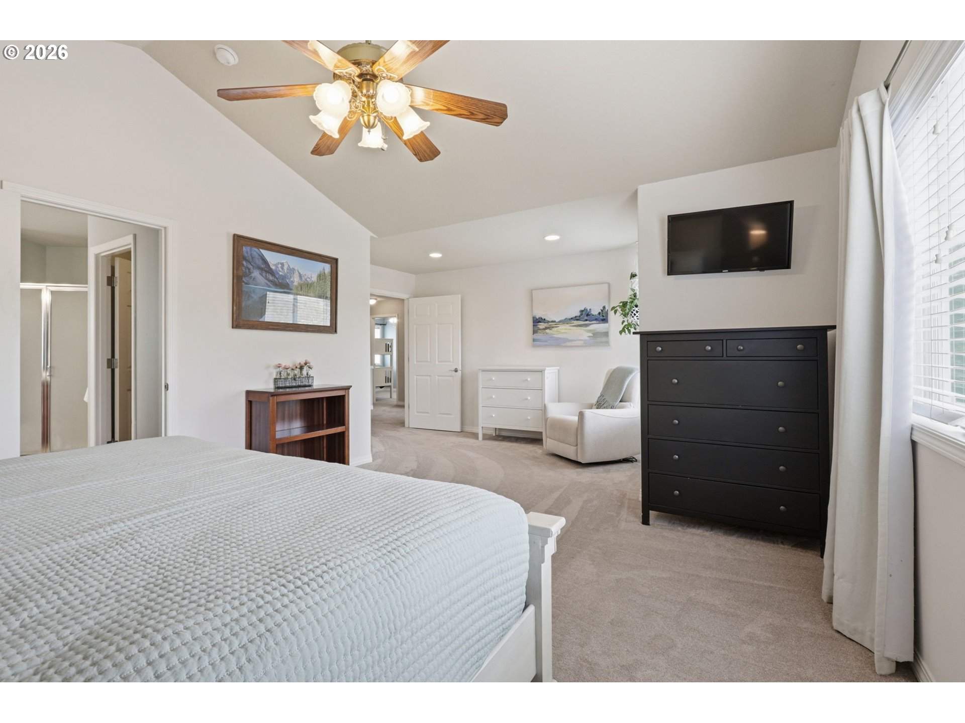 3306 Solstice Lane Newberg, OR 97132 - Photo 33 of 47 a bedroom with a bed and a chandelier