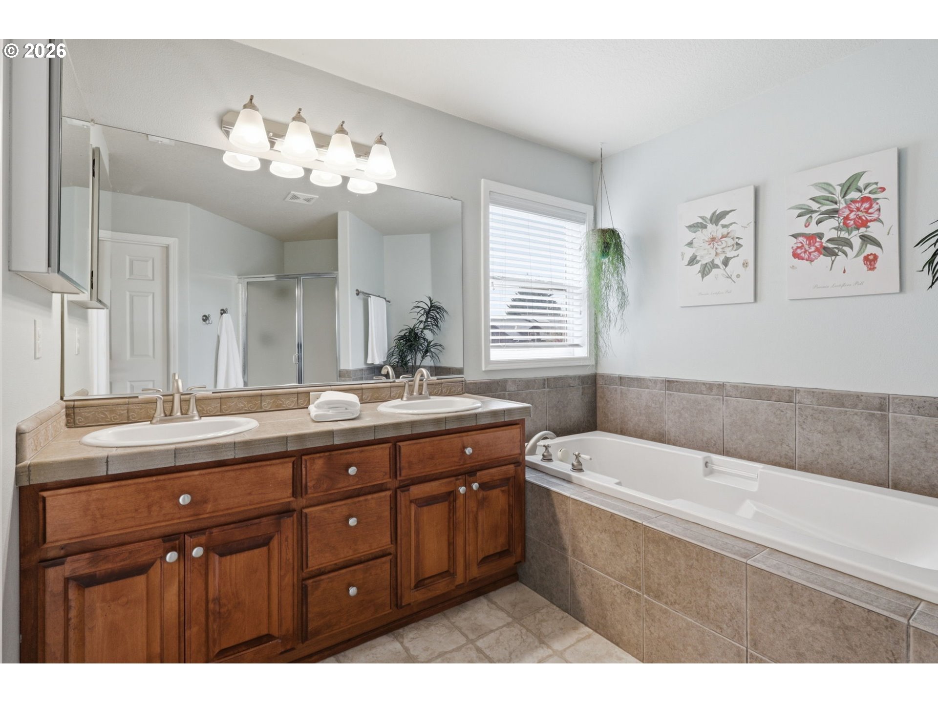 3306 Solstice Lane Newberg, OR 97132 - Photo 34 of 47 a bathroom with a tub a double vanity sink a window and a mirror