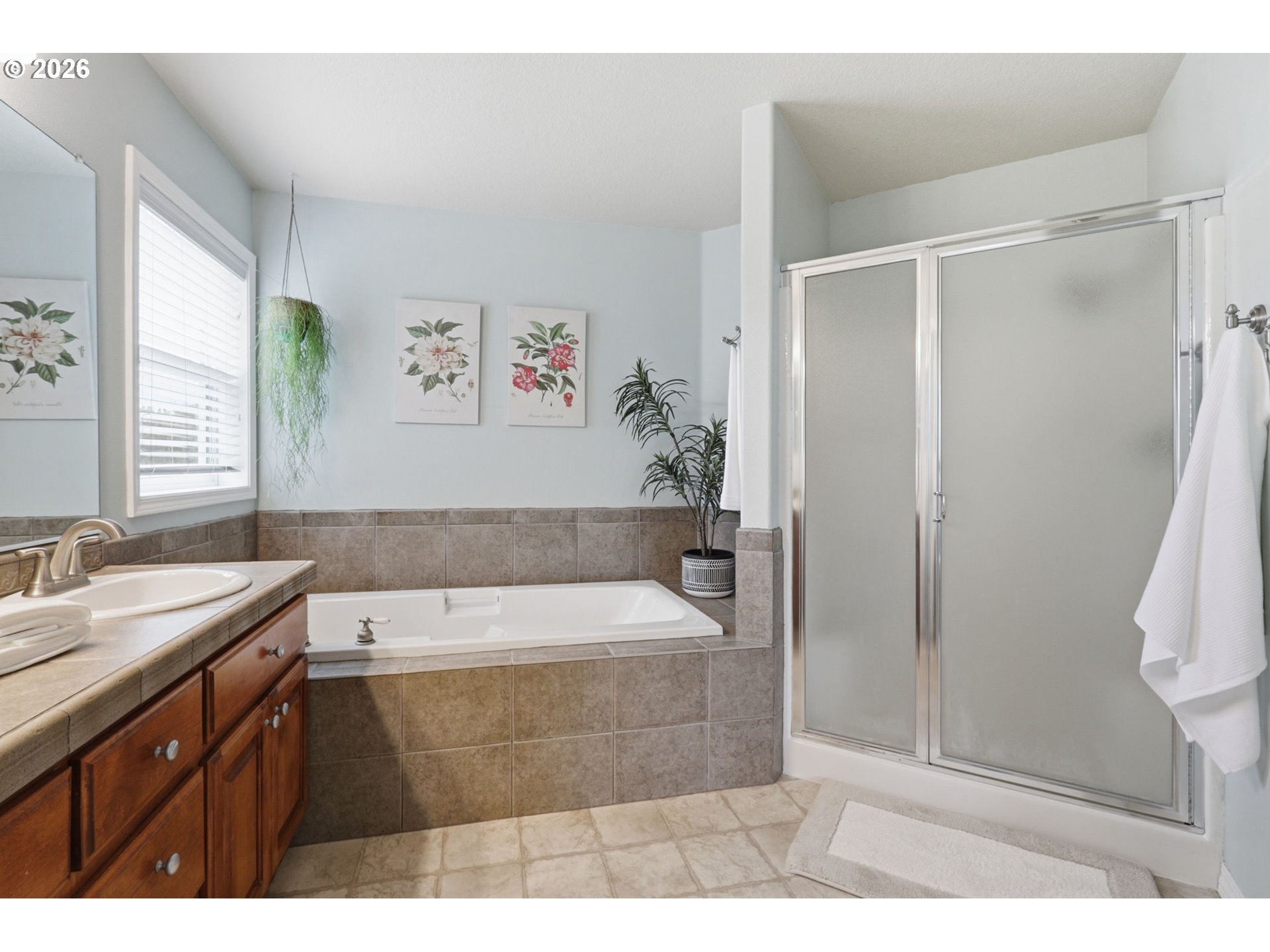 3306 Solstice Lane Newberg, OR 97132 - Photo 36 of 47 a bathroom with a tub a sink and a shower
