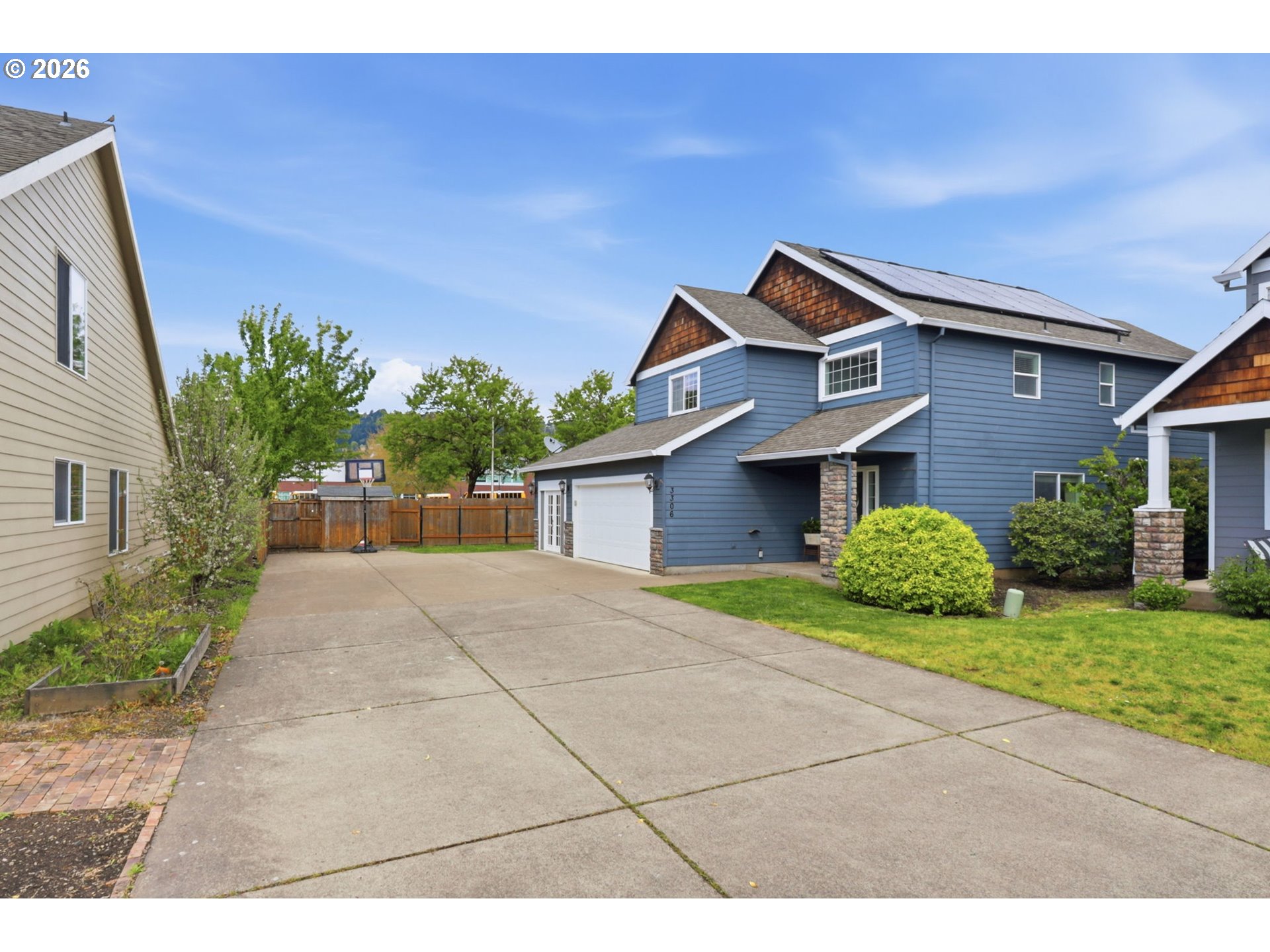 3306 Solstice Lane Newberg, OR 97132 - Photo 44 of 47 a front view of a house with a yard and garage