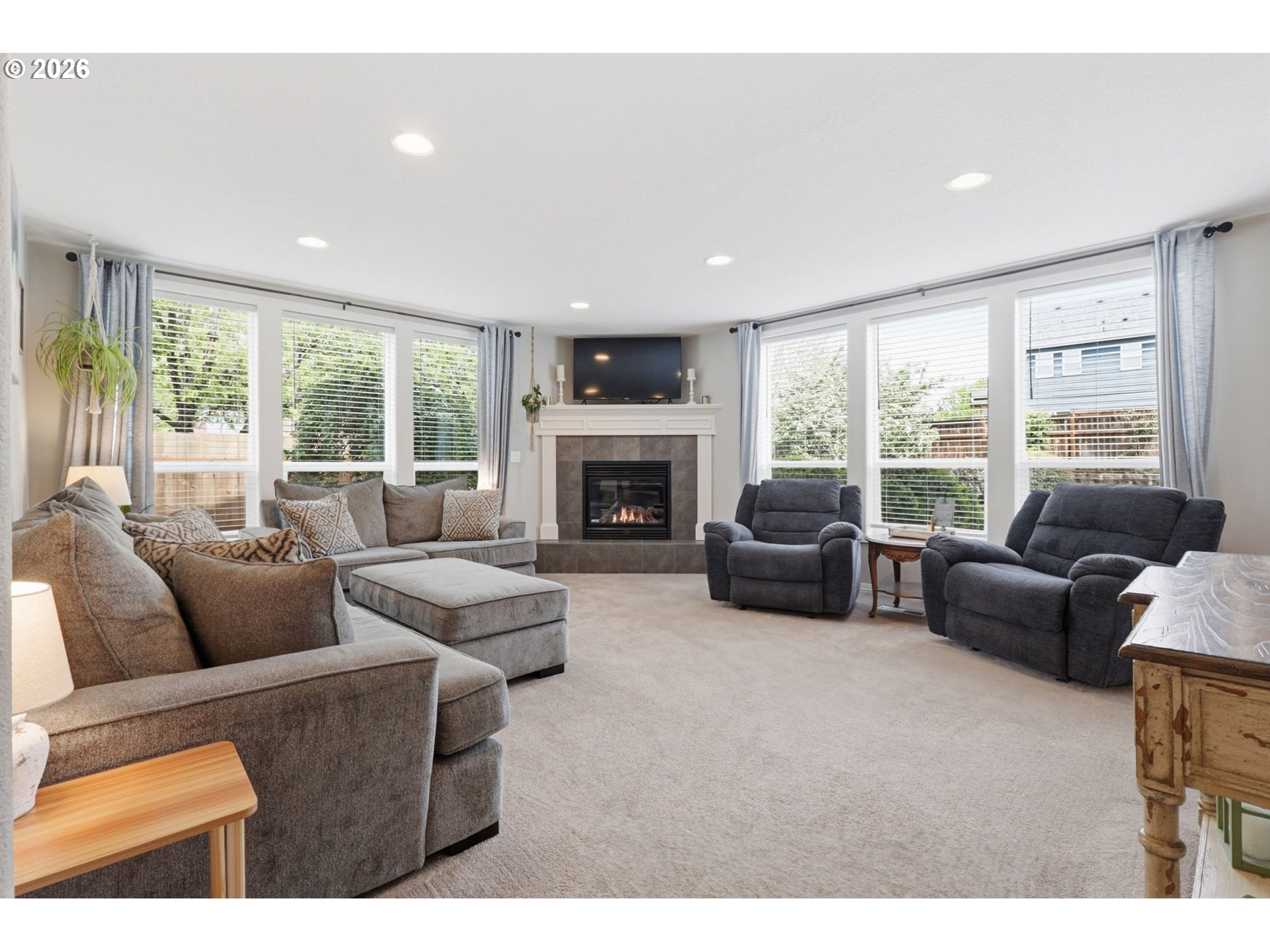3306 Solstice Lane Newberg, OR 97132 - Photo 7 of 47 a living room with furniture flat screen tv and a fireplace