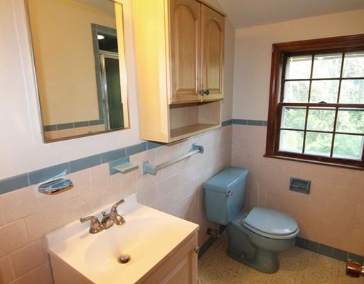 31 Dudley Road Billerica, MA 01821 - Photo 14 of 20 a bathroom with a sink a toilet and mirror