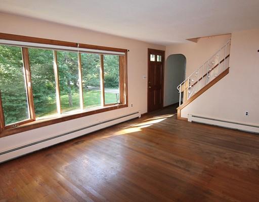 31 Dudley Road Billerica, MA 01821 - Photo 3 of 20 an empty room with wooden floor and windows